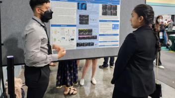 IMSD student presenting poster at SACNAS Conference 2022